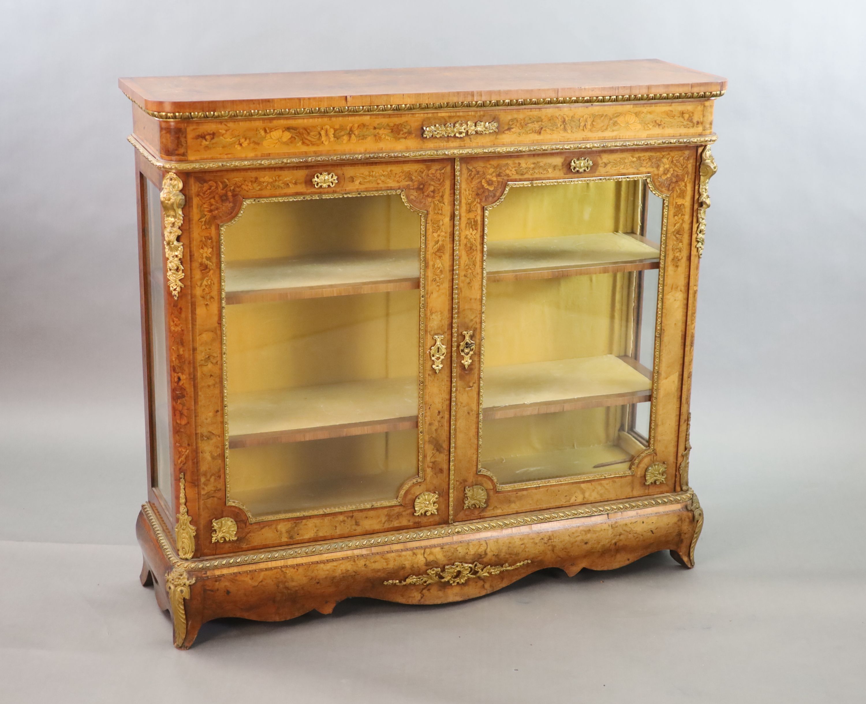 A Victorian ormolu mounted marquetry inlaid walnut bookcase, W.126cm D.38cm H.115cm